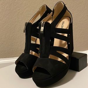 Strappy black wedge platform wedge with zipper.